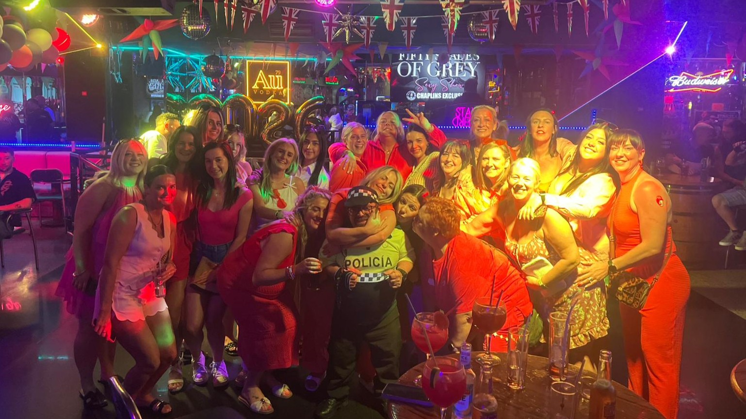 Hen party fancy dress photo with police costume and Benidorm nightlife